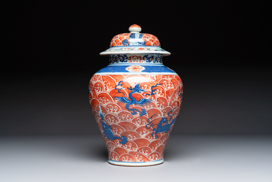 A Chinese blue, white and iron-red decorated 'Mythical Animals' vase and cover, 19th C.