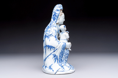 A Chinese blue and white 'Guanyin and child' group, Qianlong
