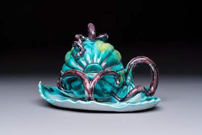 A very rare Brussels faience melon-shaped tureen and cover on stand, 18th C.
