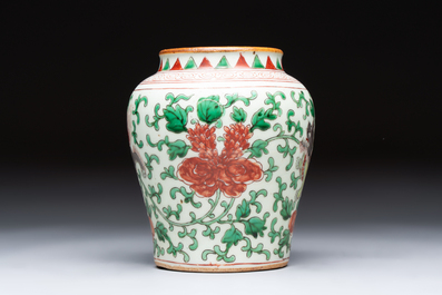 A small Chinese wucai 'Buddhist Lions and Peony Scrolls' jar, Transitional period