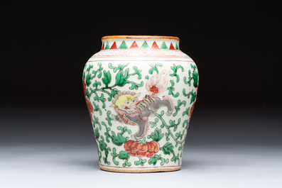 A small Chinese wucai 'Buddhist Lions and Peony Scrolls' jar, Transitional period