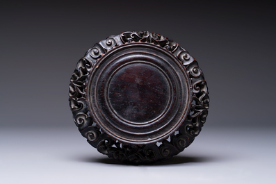 A fine Chinese silver bowl with relief dragon design on reticulated wooden stand, Tai Chang Long 泰昌隆 mark, 19th C.