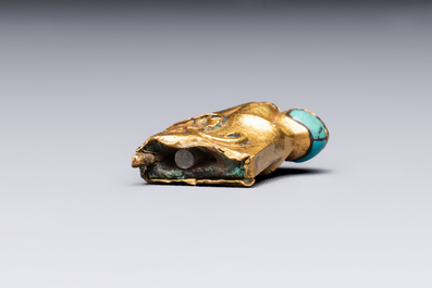 A rare Chinese turquoise- and glass-inlaid gold fitting in the form of a parrot, Han
