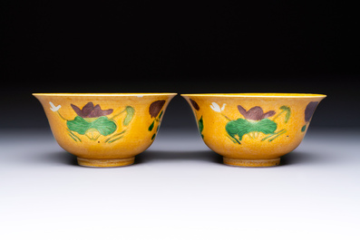 A rare pair of Chinese sancai yellow-ground 'Brinjal' bowls, Tianqi mark, 19th C.