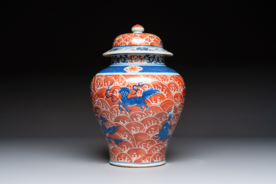A Chinese blue, white and iron-red decorated 'Mythical Animals' vase and cover, 19th C.