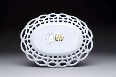 A rare white-glazed Brussels faience reticulated basket on stand, 18th C.