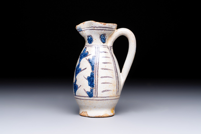 A rare intact early Italian maiolica ewer inscribed 'G', Montelupo, 15th C.