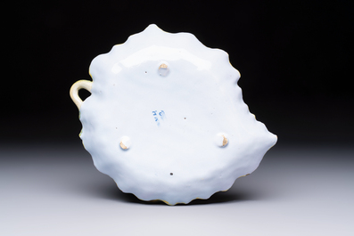 A polychrome Dutch Delft melon-shaped tureen and cover on leaf-shaped stand, 18th C.
