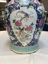 A large Chinese famille rose vase with lion-form handles and cover, 19th C.