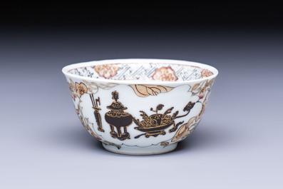 A Chinese gilt-decorated black-enamelled 'Antiquities' cup, Yongzheng/Qianlong