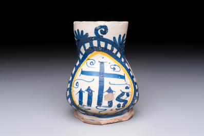 A very rare polychrome Antwerp maiolica 'IHS' jug, 16th C.