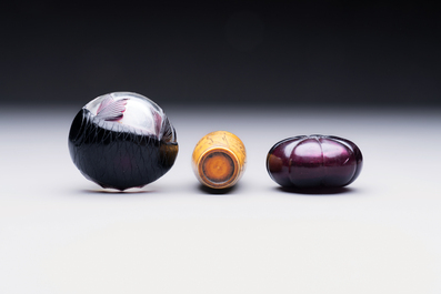 Two Chinese glass snuff bottles and a buffalo bone snuff bottle, Xianfeng mark, 19th C.