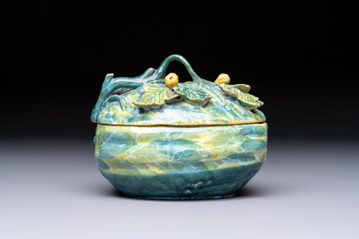 A polychrome Dutch Delft melon-shaped tureen and cover on leaf-shaped stand, 18th C.