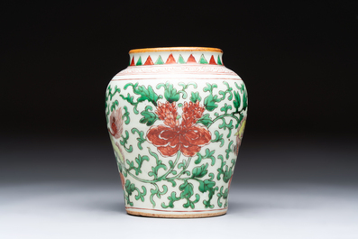 A small Chinese wucai 'Buddhist Lions and Peony Scrolls' jar, Transitional period