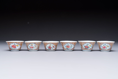 Six Chinese famille rose gilt-decorated 'Flower Basket' cups and saucers, Yongzheng/Qianlong