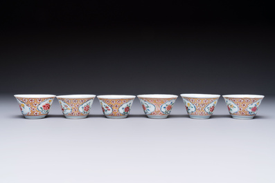 Six Chinese famille rose gilt-decorated 'Flower Basket' cups and saucers, Yongzheng/Qianlong