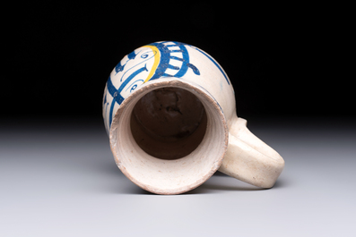 A very rare polychrome Antwerp maiolica 'IHS' jug, 16th C.
