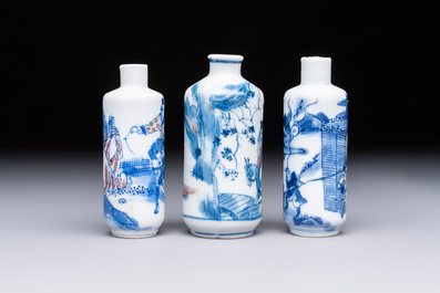 Three Chinese blue, white and copper-red snuff bottles with narrative design, 19th C.