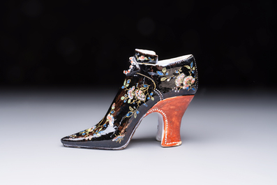 An extremely rare black Delftware model of a shoe, early 18th C.