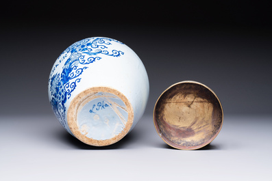 A blue and white Dutch Delft tobacco jar inscribed 'Duinkerker' with brass lid, 18th C.