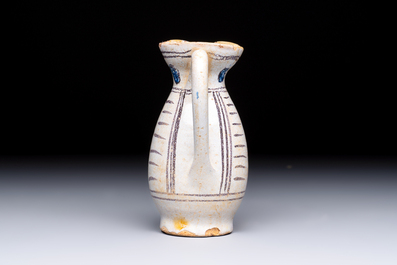 A rare intact early Italian maiolica ewer inscribed 'G', Montelupo, 15th C.