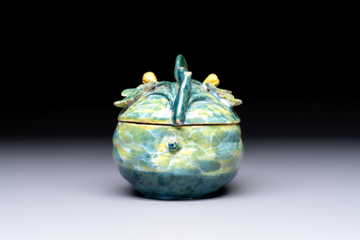 A polychrome Dutch Delft melon-shaped tureen and cover on leaf-shaped stand, 18th C.