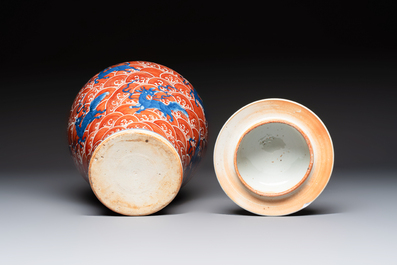 A Chinese blue, white and iron-red decorated 'Mythical Animals' vase and cover, 19th C.