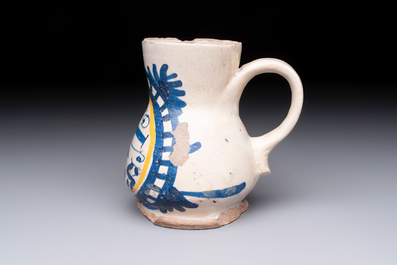 A very rare polychrome Antwerp maiolica 'IHS' jug, 16th C.