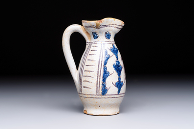 A rare intact early Italian maiolica ewer inscribed 'G', Montelupo, 15th C.
