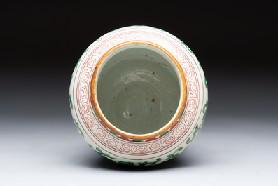 A small Chinese wucai 'Buddhist Lions and Peony Scrolls' jar, Transitional period