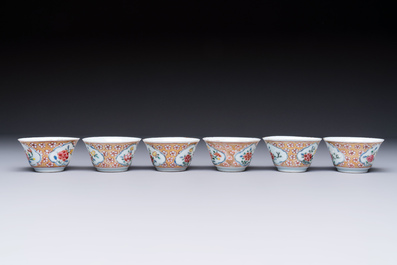Six Chinese famille rose gilt-decorated 'Flower Basket' cups and saucers, Yongzheng/Qianlong