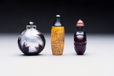 Two Chinese glass snuff bottles and a buffalo bone snuff bottle, Xianfeng mark, 19th C.