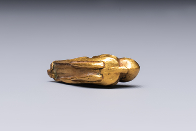 A rare Chinese turquoise- and glass-inlaid gold fitting in the form of a parrot, Han