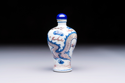 A Chinese blue, white and copper-red 'Dragon' snuff bottle, 19th C.