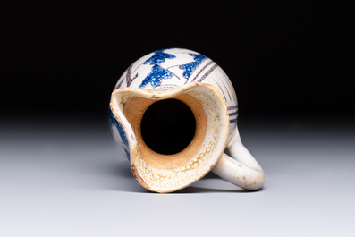 A rare intact early Italian maiolica ewer inscribed 'G', Montelupo, 15th C.