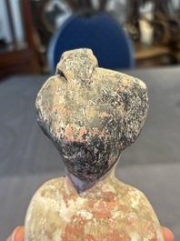 Two Chinese polychrome pottery figures and a female head, Tang