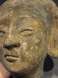 Two Chinese polychrome pottery figures and a female head, Tang