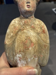 Two Chinese polychrome pottery figures and a female head, Tang