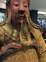 A large Chinese gilt-lacquered and polychrome wooden figure of Guandi, 19th C.