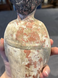 Two Chinese polychrome pottery figures and a female head, Tang