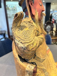A large Chinese gilt-lacquered and polychrome wooden figure of Guandi, 19th C.