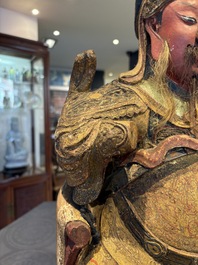 A large Chinese gilt-lacquered and polychrome wooden figure of Guandi, 19th C.