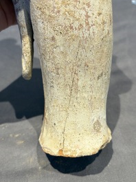 Two Chinese polychrome pottery figures and a female head, Tang
