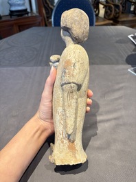 Two Chinese polychrome pottery figures and a female head, Tang