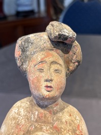 Two Chinese polychrome pottery figures and a female head, Tang