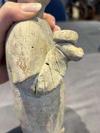 Two Chinese polychrome pottery figures and a female head, Tang