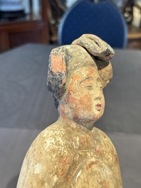Two Chinese polychrome pottery figures and a female head, Tang