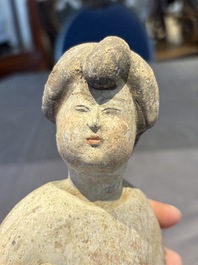 Two Chinese polychrome pottery figures and a female head, Tang
