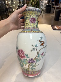 Seven Chinese famille rose vases, a scroll jar and a jardini&egrave;re on a stand, Qianlong marks, 20th C.