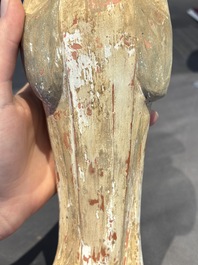 Two Chinese polychrome pottery figures and a female head, Tang